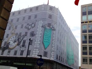 Building under scaffolding with a decorative building wrap cover for Fortnum & Mason
