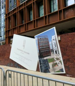 Fallen construction signboards at Pancras Square development site in London