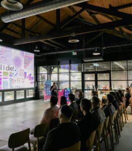 Birmingham Design Festival 2026, an auditorium full of people with a speaker giving a talk